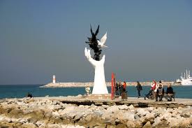 Hand Sculpture and Coastal Strip